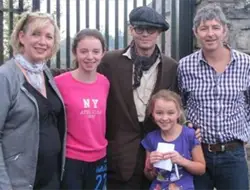 Johnny Depp has his picture taken with fans at Weir's pub